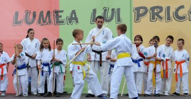 Kids sparring in a martial arts event.
